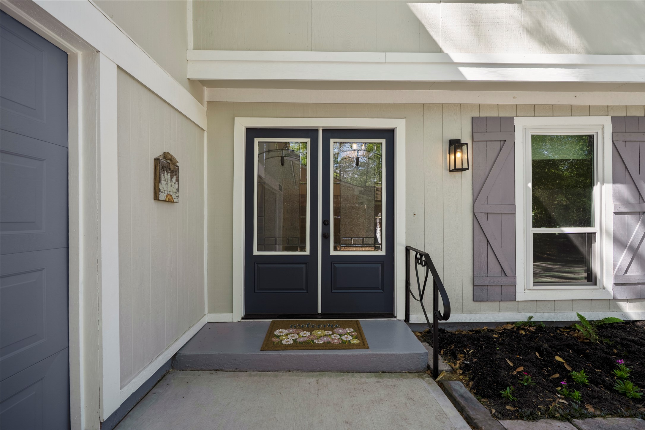 12224 Gun Oak Place Spring, TX 77380 - Photo 3 of 42 Inviting front entry with classic detailing sets the tone for a home that feels warm, welcoming, and thoughtfully cared for.
