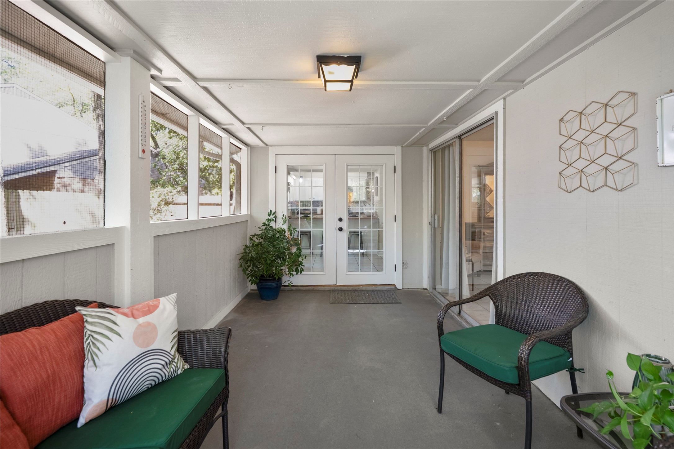 12224 Gun Oak Place Spring, TX 77380 - Photo 31 of 42 Light-filled and serene, this space invites year-round enjoyment while staying connected to the outdoors.