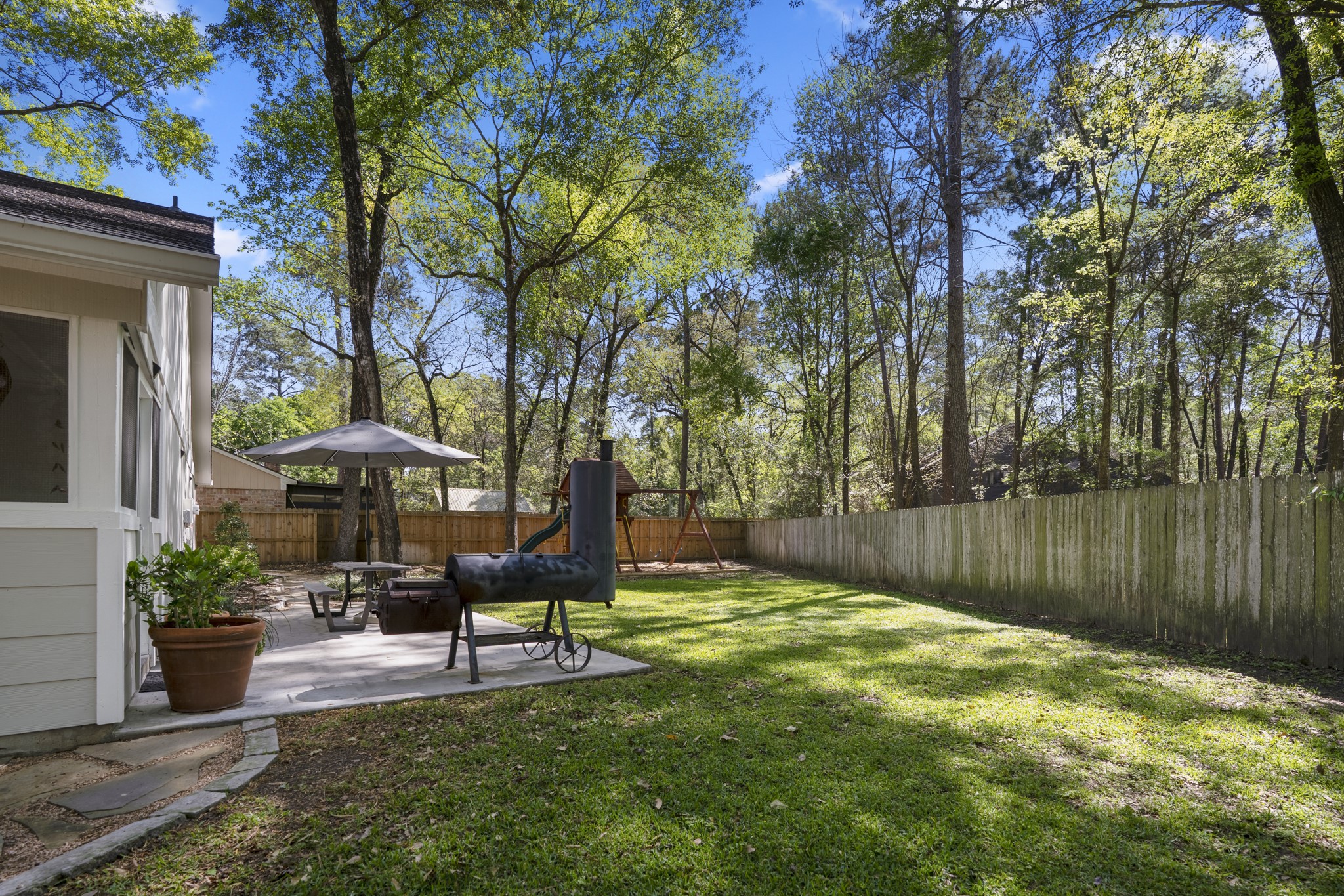 12224 Gun Oak Place Spring, TX 77380 - Photo 33 of 42 A private outdoor retreat with room to entertain, unwind, or simply enjoy the quiet surroundings.