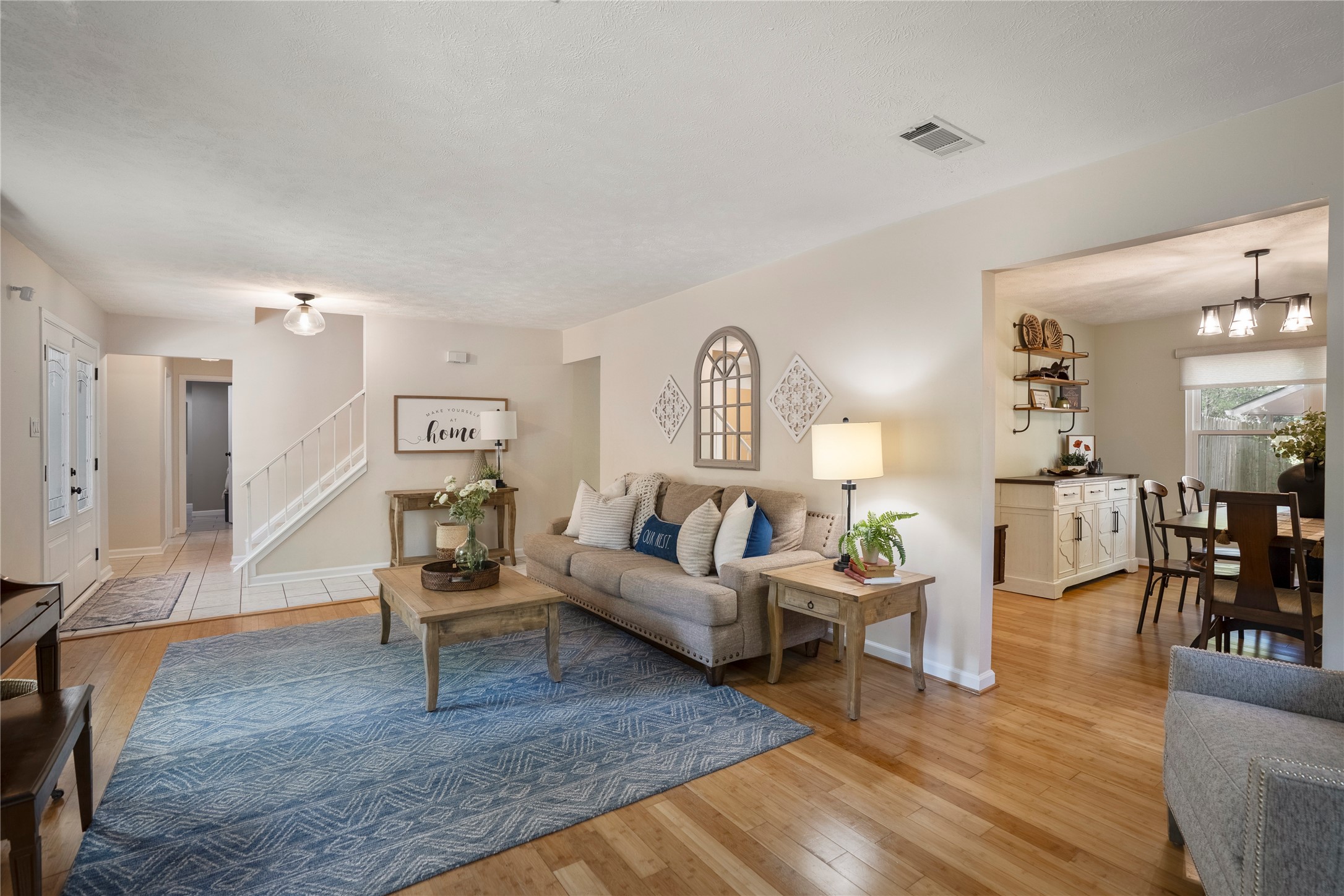 12224 Gun Oak Place Spring, TX 77380 - Photo 7 of 42 Seamless flow between living spaces creates a sense of openness while maintaining distinct areas for living and hosting.