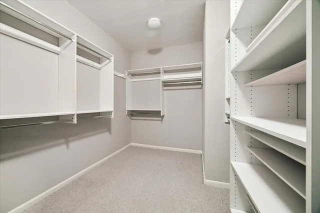 a view of an empty walk in closet