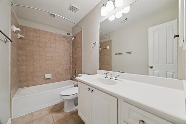 a bathroom with a sink a toilet and a bathtub