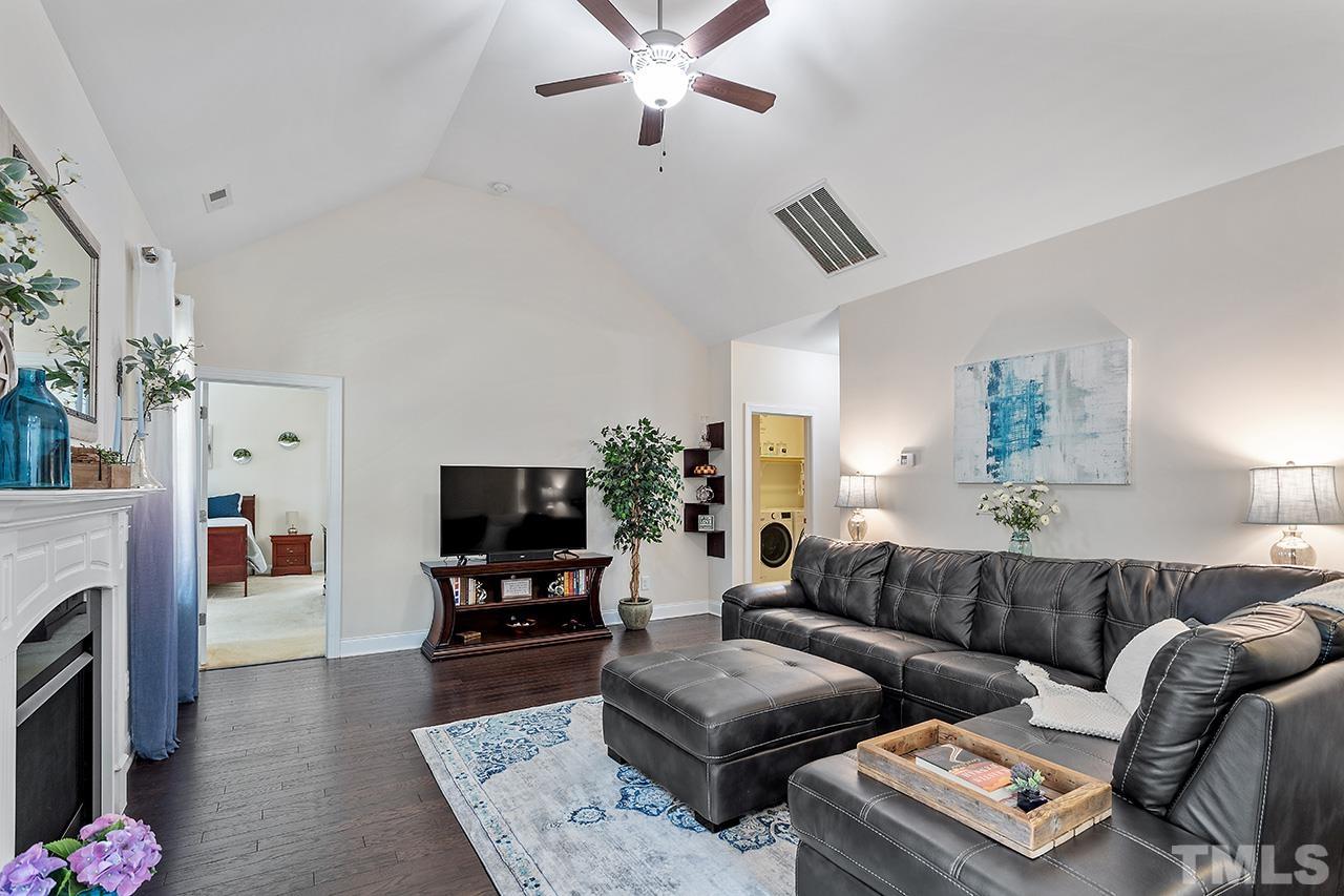 3622 Pine Needles Drive Wake Forest, NC 27587 - Photo 12 of 35 a living room with furniture and a flat screen tv