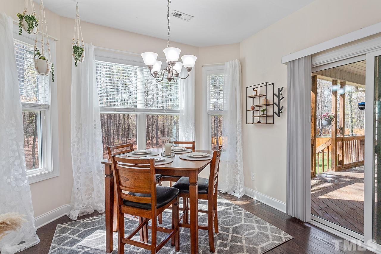 3622 Pine Needles Drive Wake Forest, NC 27587 - Photo 19 of 35 a view of a dining room with furniture window and outside view