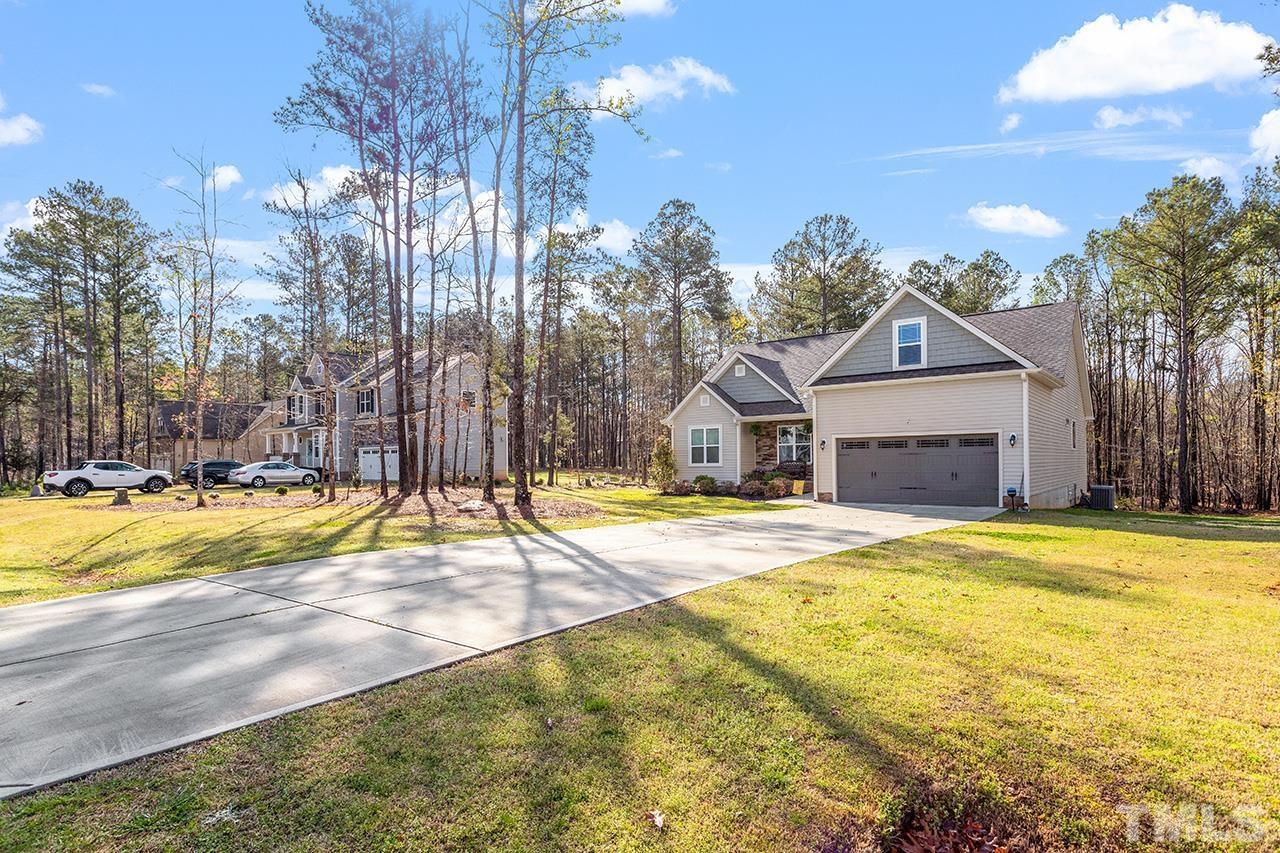 3622 Pine Needles Drive Wake Forest, NC 27587 - Photo 4 of 35 a swimming pool with outdoor seating and yard
