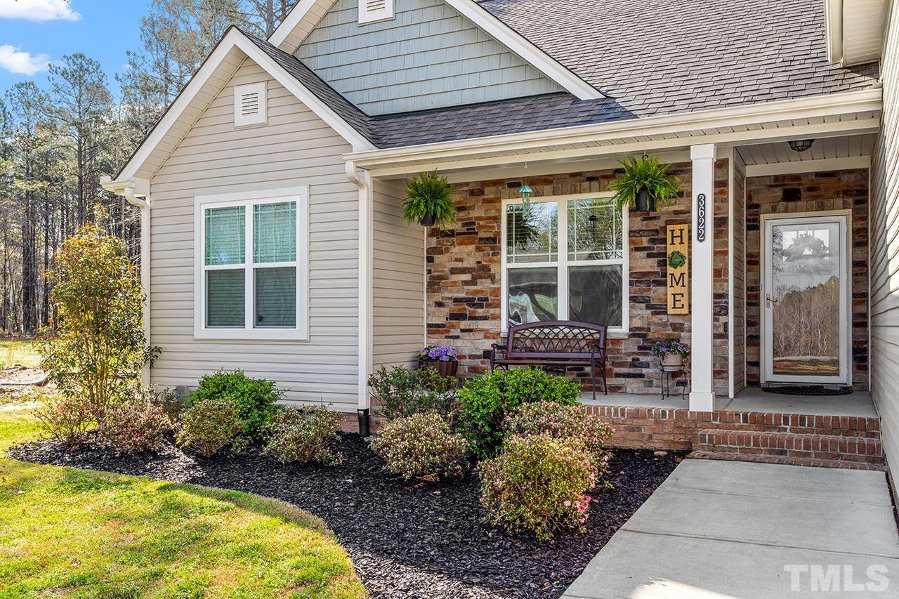 3622 Pine Needles Drive Wake Forest, NC 27587 - Photo 5 of 35 a front view of a house with garden