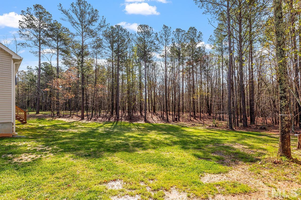 3622 Pine Needles Drive Wake Forest, NC 27587 - Photo 6 of 35 a swimming pool with tall trees