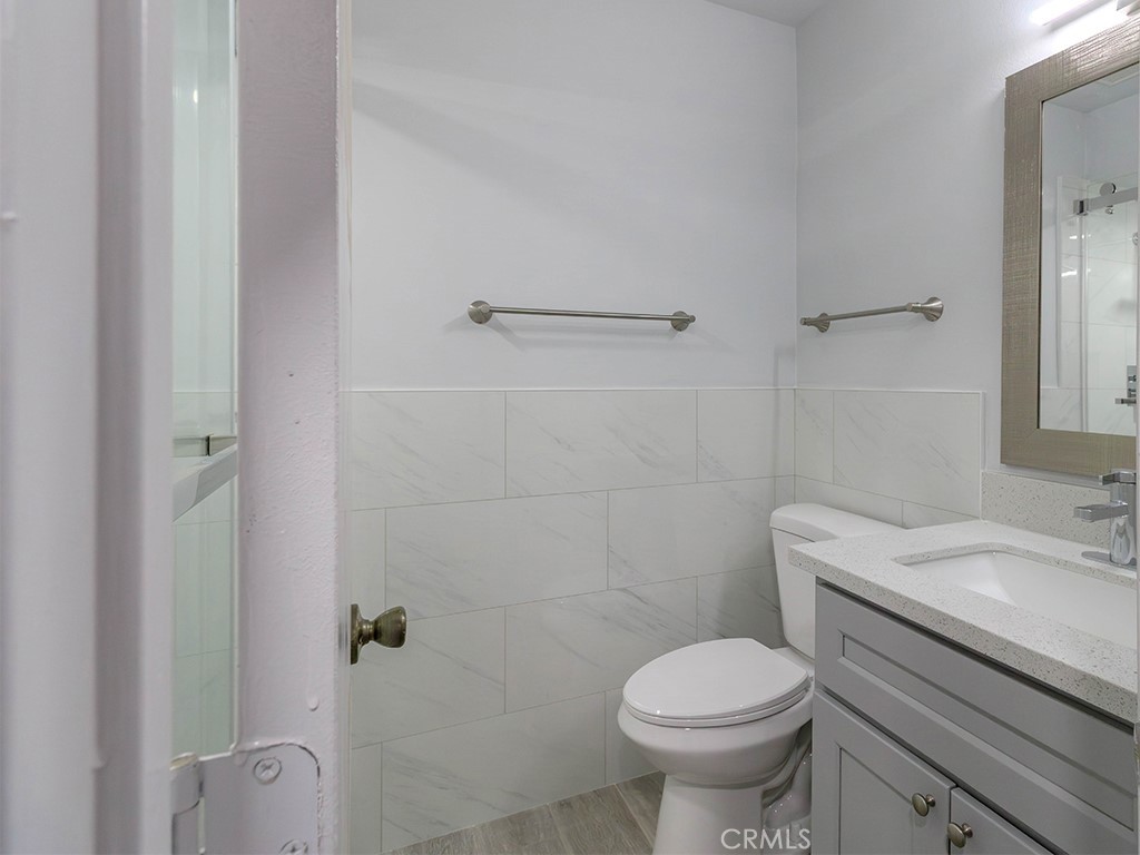 518 West Alpine Avenue Santa Ana, CA 92707 - Photo 12 of 29 a bathroom with a sink toilet and shower