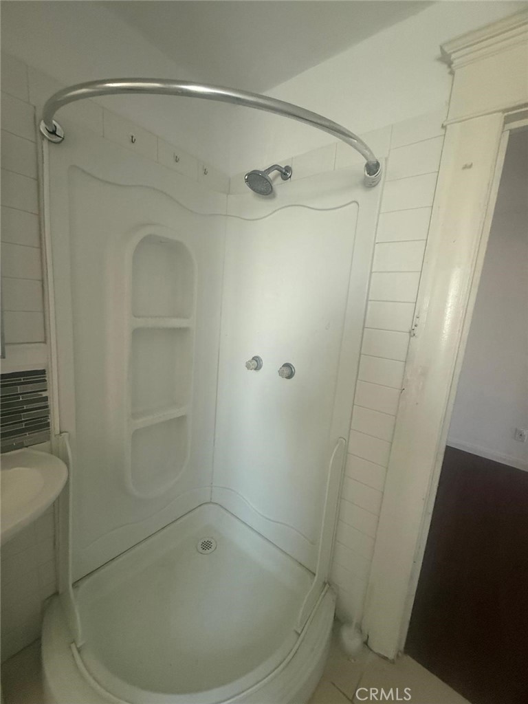 1527 North Broadway, Unit 2 Santa Ana, CA 92701 - Photo 12 of 21 a bathroom with a shower and a toilet
