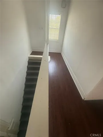 a view of entryway with wooden floor