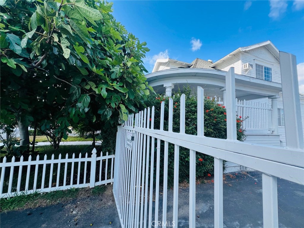 1527 North Broadway, Unit 2 Santa Ana, CA 92701 - Photo 20 of 21 a view of a wooden house with a large window and wooden fence