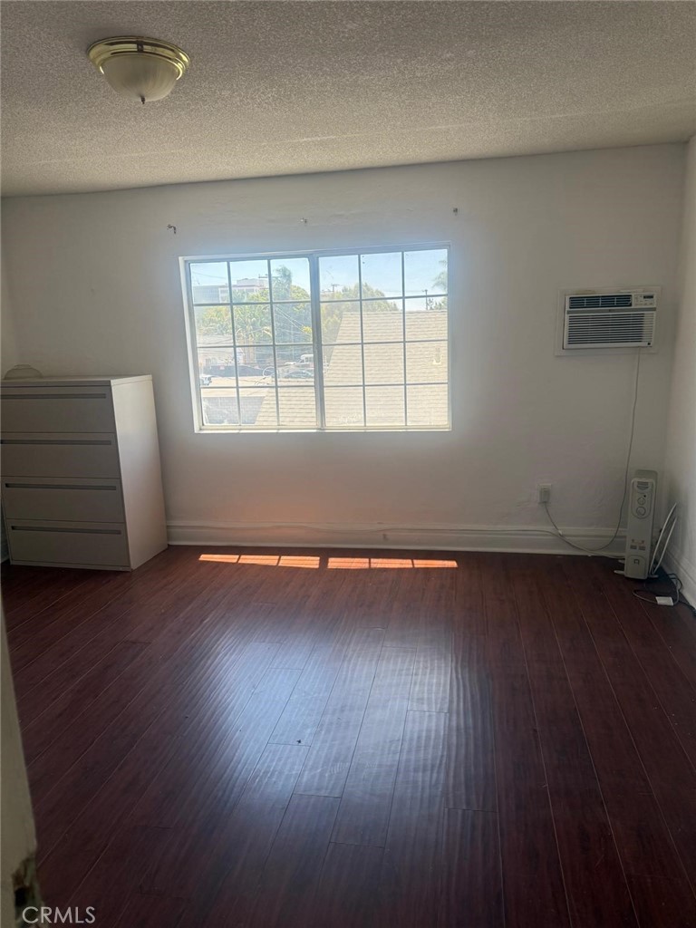 1527 North Broadway, Unit 2 Santa Ana, CA 92701 - Photo 7 of 21 an empty room with wooden floor and windows