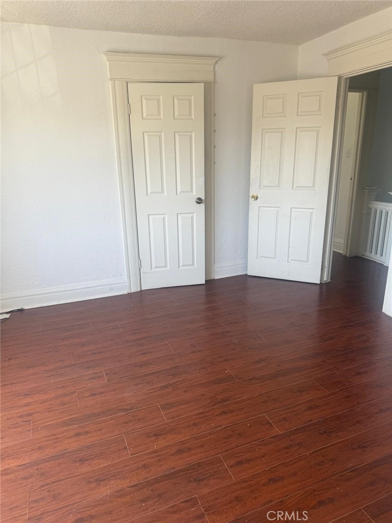 1527 North Broadway, Unit 2 Santa Ana, CA 92701 - Photo 9 of 21 a view of an empty room with wooden floor