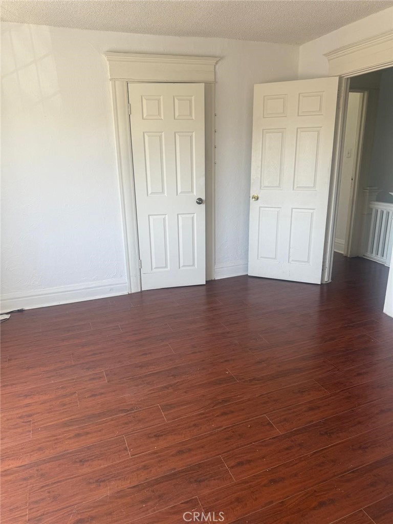 1527 North Broadway, Unit 2 Santa Ana, CA 92701 - Photo 10 of 21 a view of an empty room with wooden floor