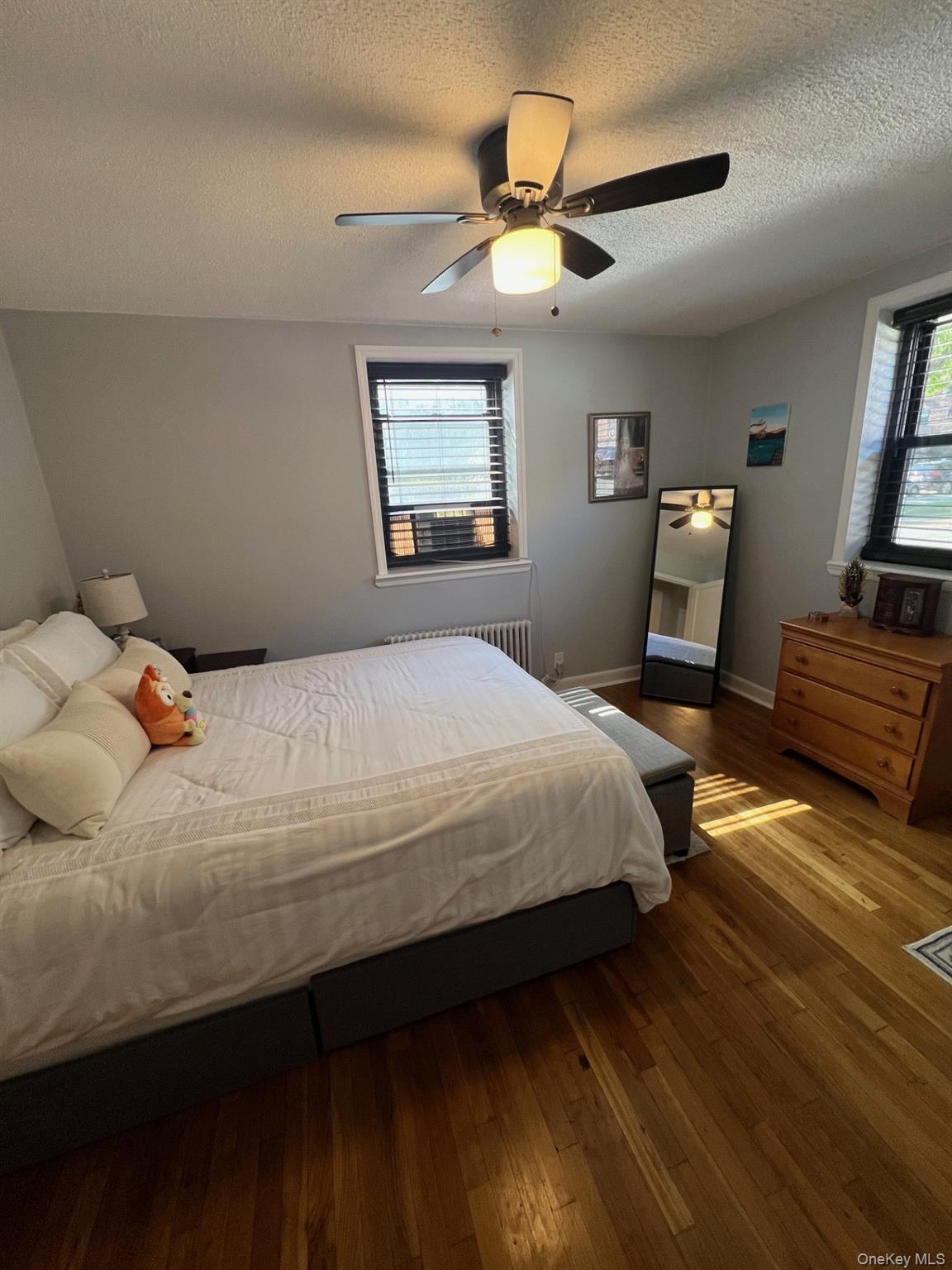 200 Richbell Road, Unit A2 Mamaroneck, NY 10543 - Photo 10 of 14 a bedroom with a bed and a chandelier