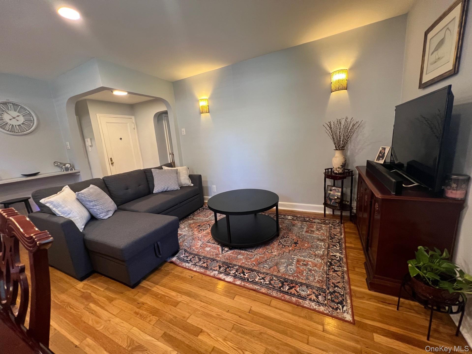 200 Richbell Road, Unit A2 Mamaroneck, NY 10543 - Photo 12 of 14 a living room with furniture and a flat screen tv