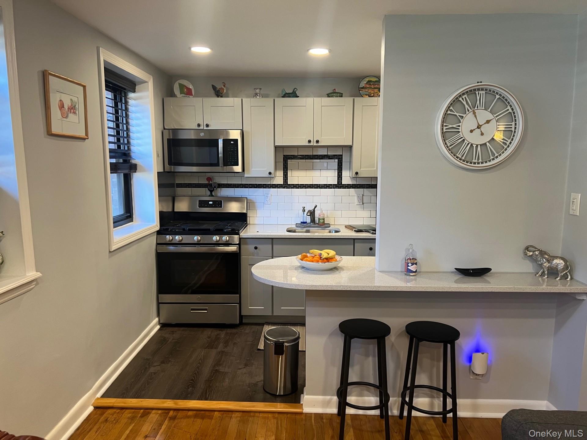 200 Richbell Road, Unit A2 Mamaroneck, NY 10543 - Photo 3 of 14 a kitchen with a refrigerator and a stove top oven