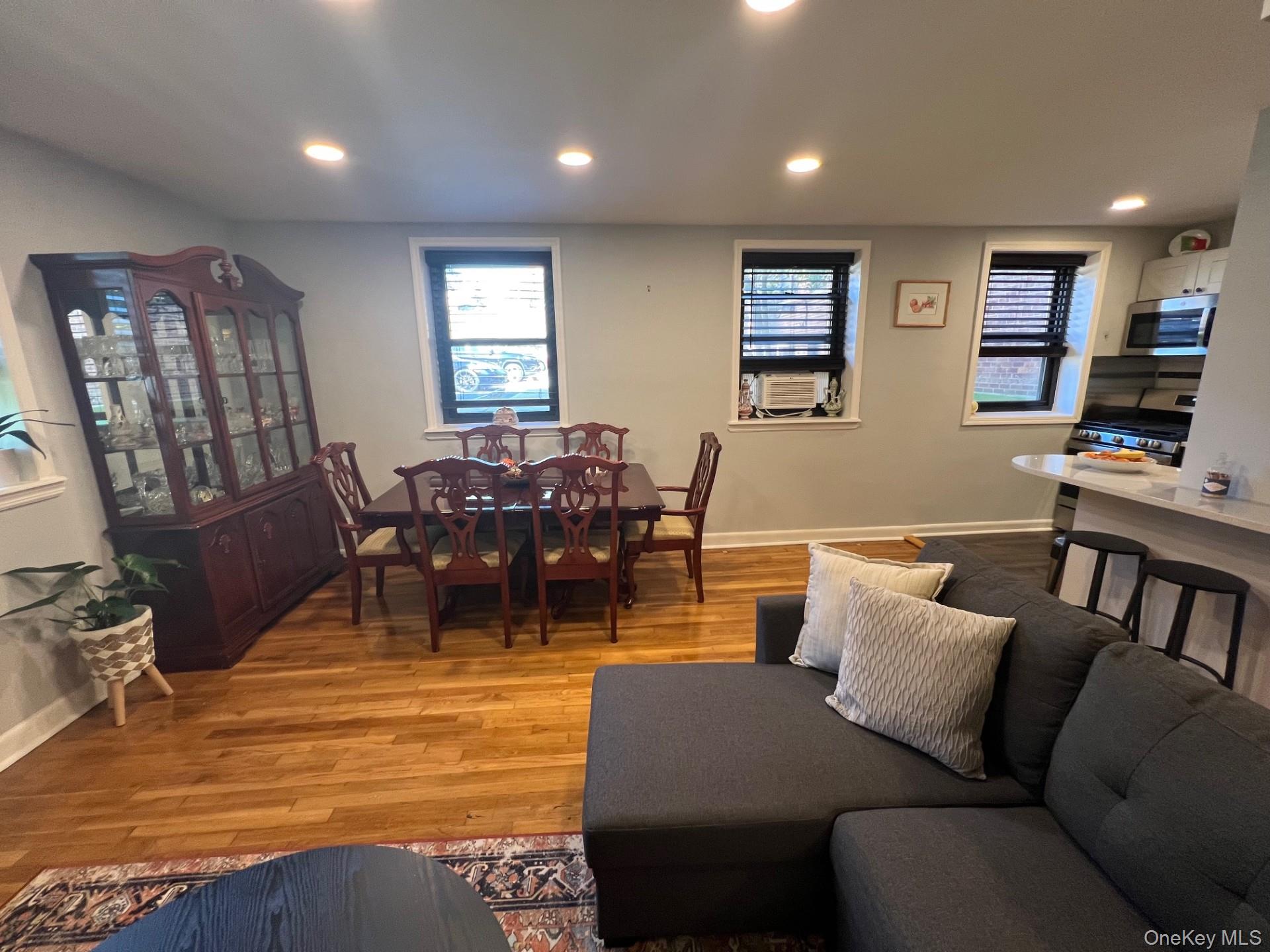 200 Richbell Road, Unit A2 Mamaroneck, NY 10543 - Photo 6 of 14 a living room with furniture a flat screen tv and a window