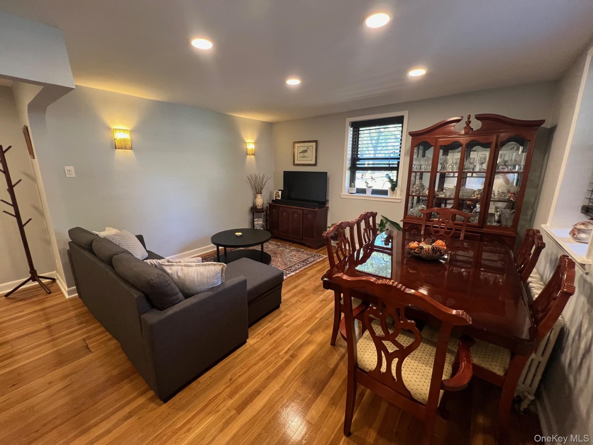 200 Richbell Road, Unit A2 Mamaroneck, NY 10543 - Photo 7 of 14 a living room with furniture and a flat screen tv