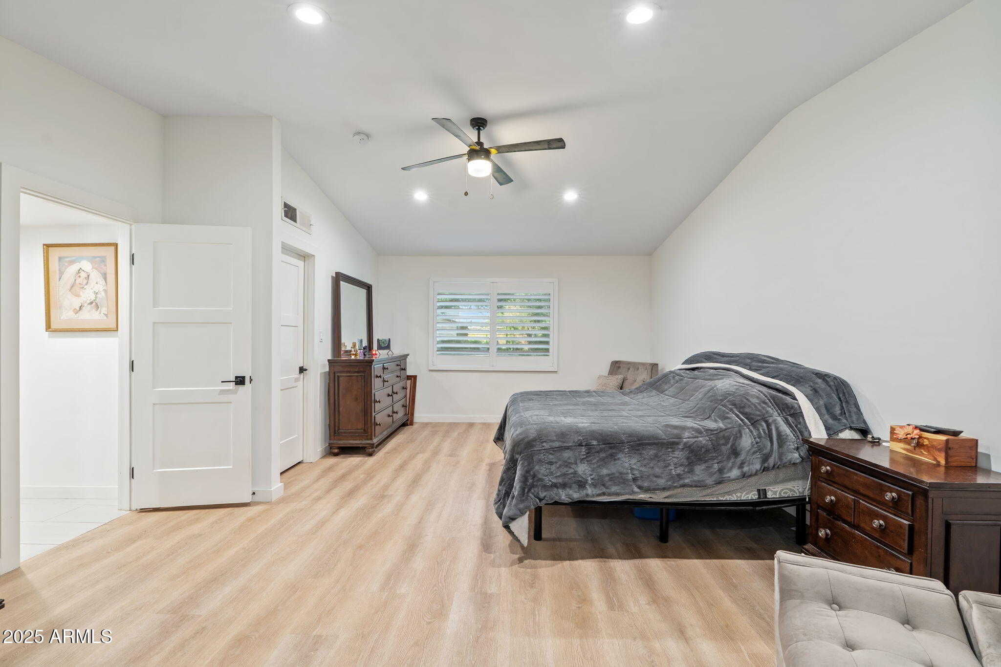 3901 North 19th Street Phoenix, AZ 85016 - Photo 12 of 24 a bedroom with a bed dresser and a window