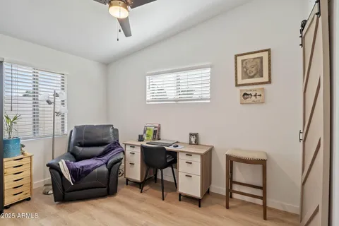 a work room with furniture and windows