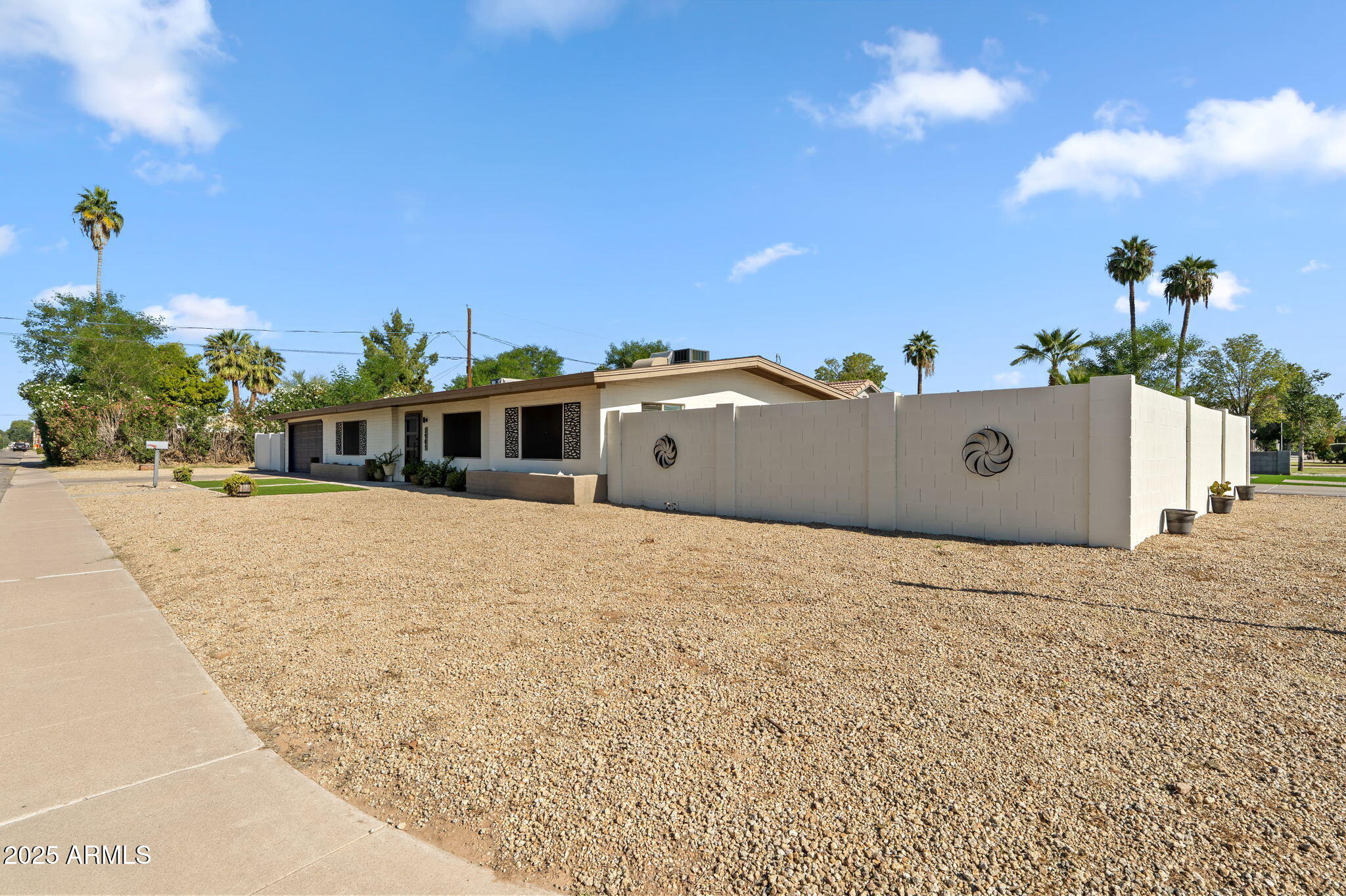 3901 North 19th Street Phoenix, AZ 85016 - Photo 3 of 24 a front view of a house with a yard