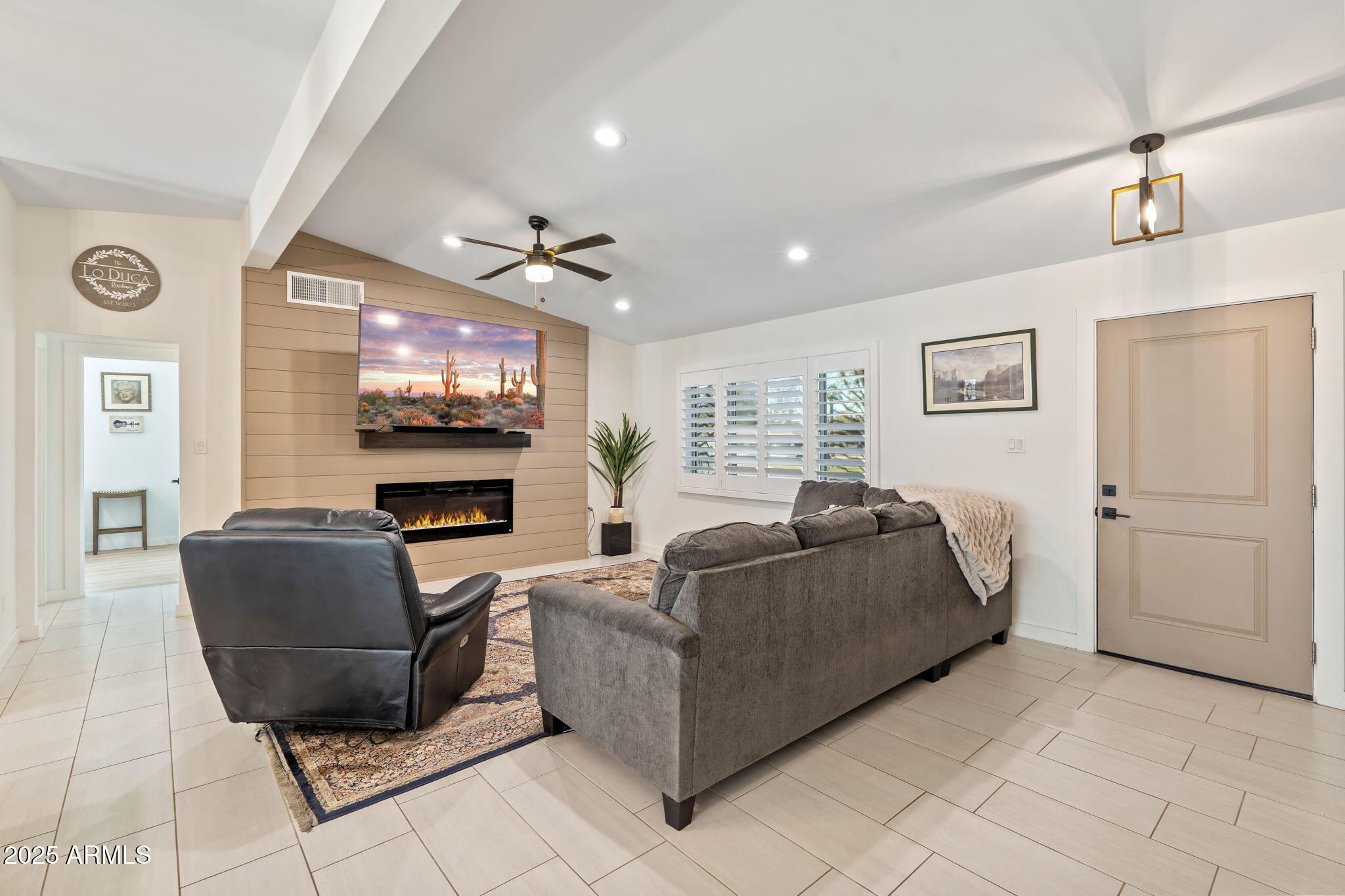 3901 North 19th Street Phoenix, AZ 85016 - Photo 5 of 24 a living room with furniture and a flat screen tv