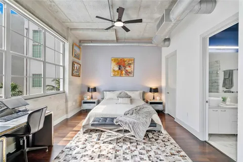 a living room with furniture and a rug