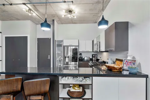 a kitchen with a sink cabinets and window