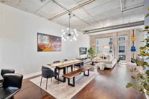 a living room with lots of furniture and a chandelier