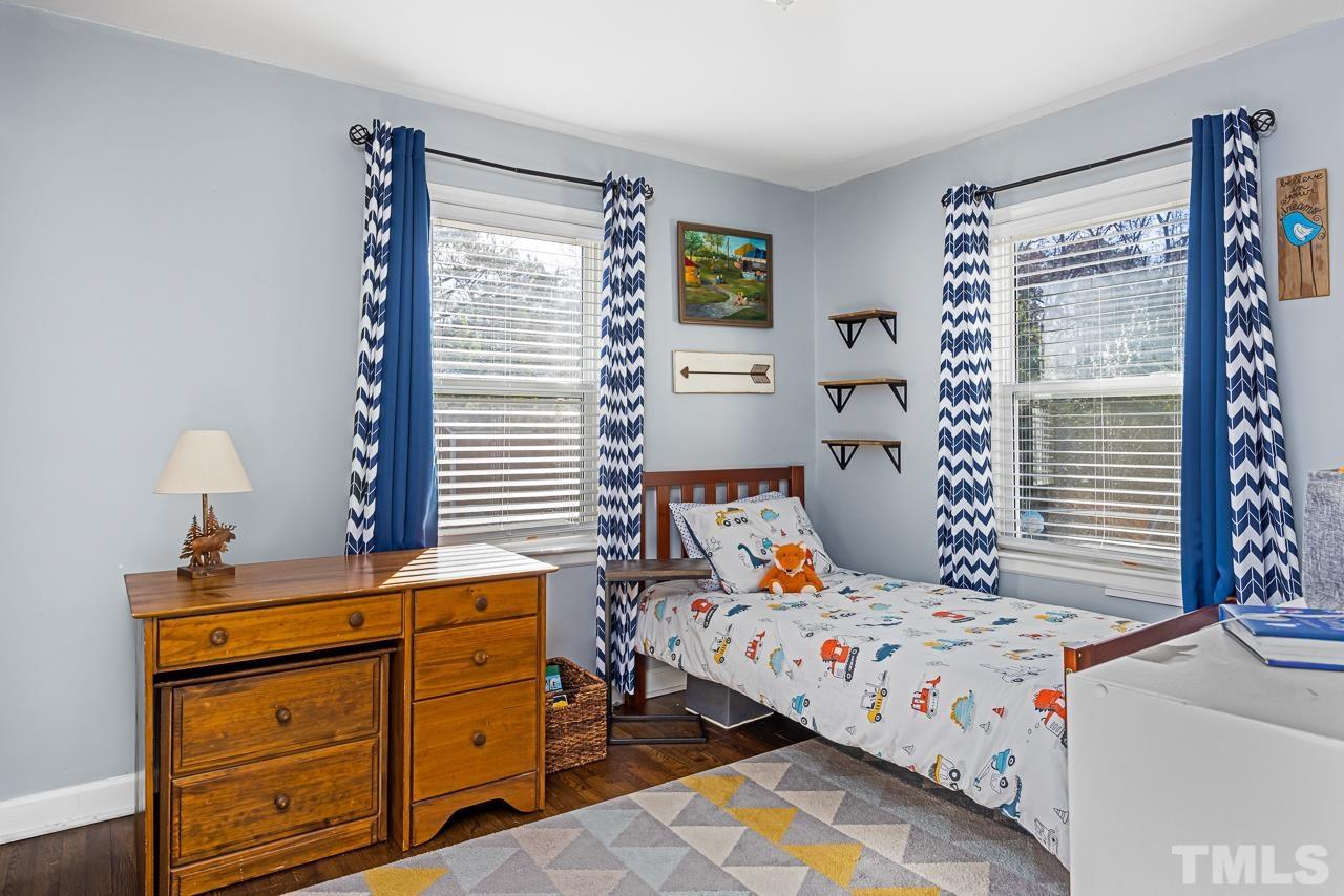 2458 Stevens Road Raleigh, NC 27610 - Photo 13 of 20 a bedroom with a bed and a window