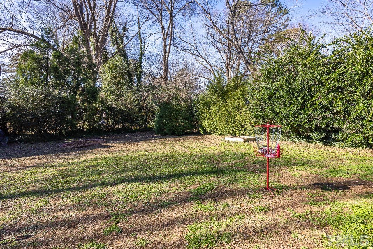 2458 Stevens Road Raleigh, NC 27610 - Photo 18 of 20 a backyard of a house with lots of green space
