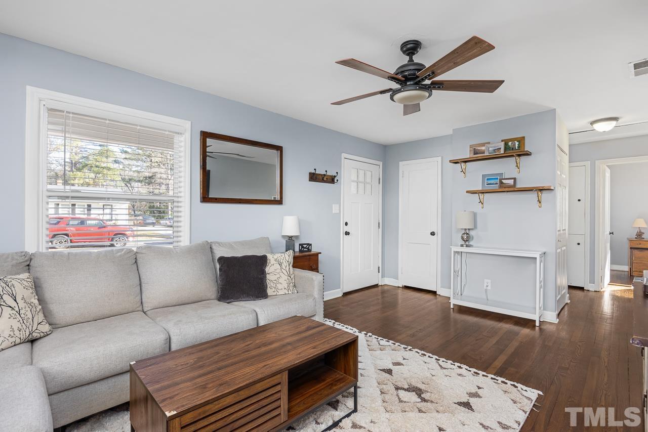 2458 Stevens Road Raleigh, NC 27610 - Photo 7 of 20 a living room with furniture and a wooden floor