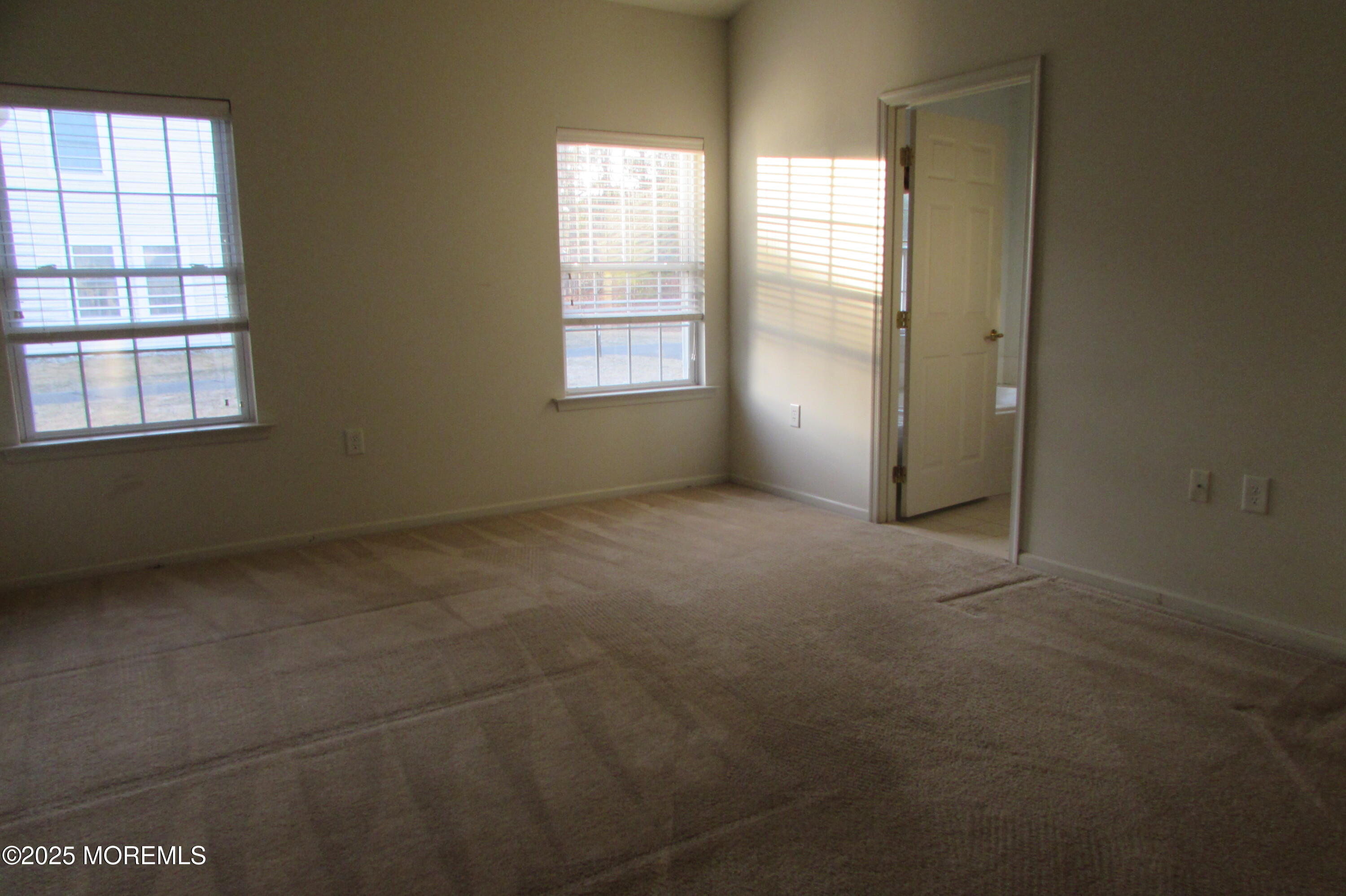 66 Strathmere Street Waretown, NJ 08758 - Photo 12 of 29 an empty room with windows