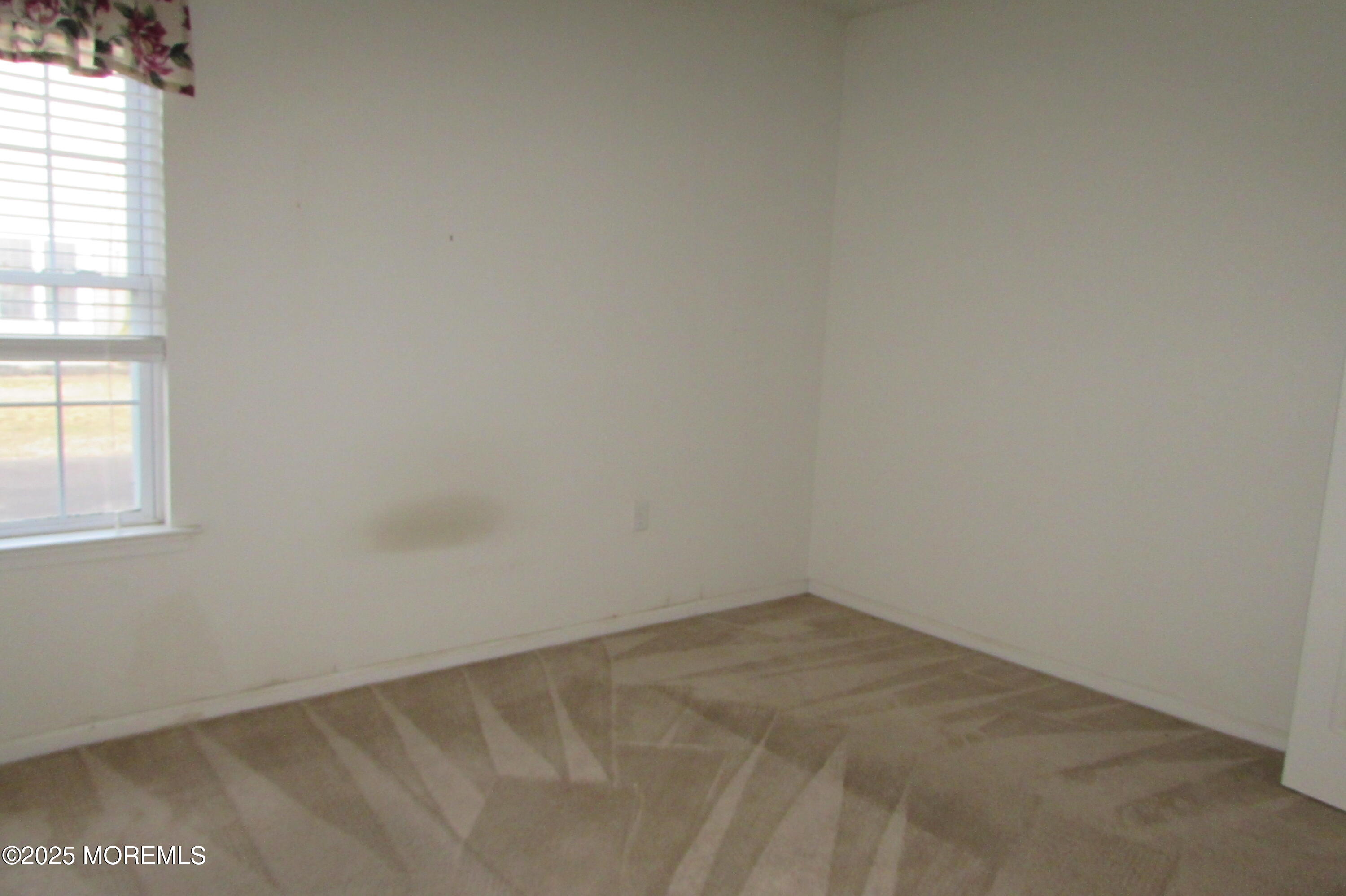 66 Strathmere Street Waretown, NJ 08758 - Photo 16 of 29 an empty room with a window