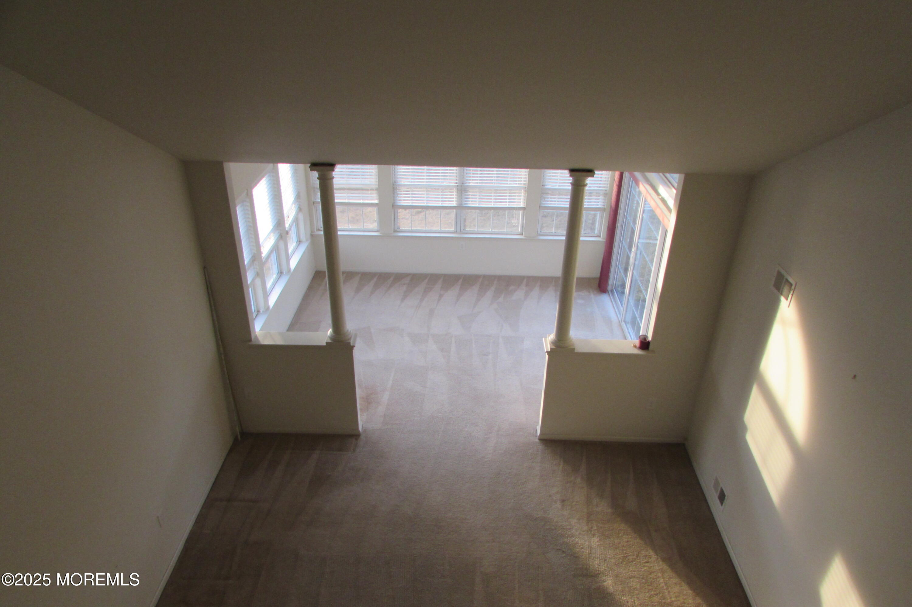 66 Strathmere Street Waretown, NJ 08758 - Photo 22 of 29 wooden floor in an empty room with a window