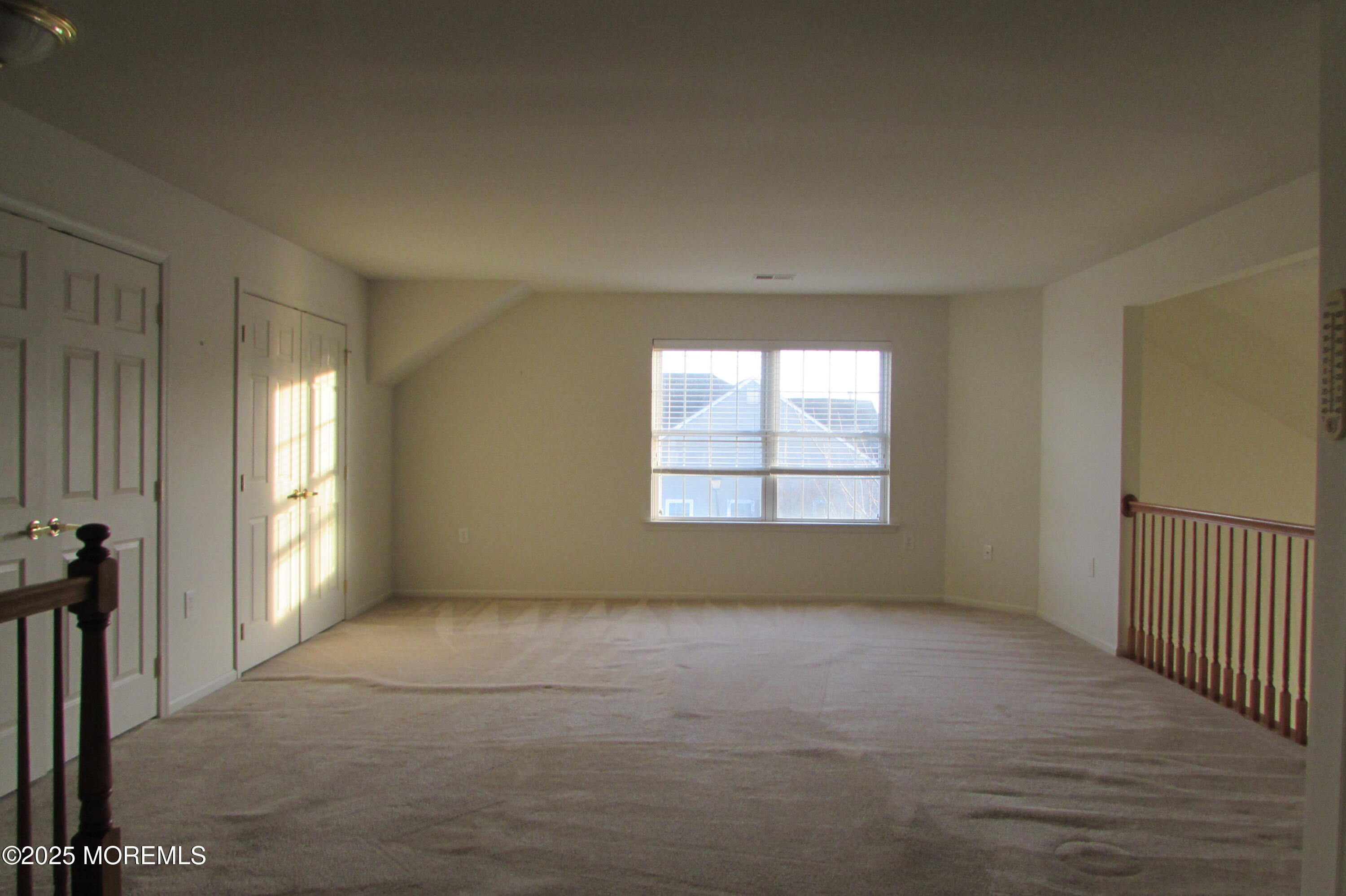 66 Strathmere Street Waretown, NJ 08758 - Photo 26 of 29 a view of an empty room with a window