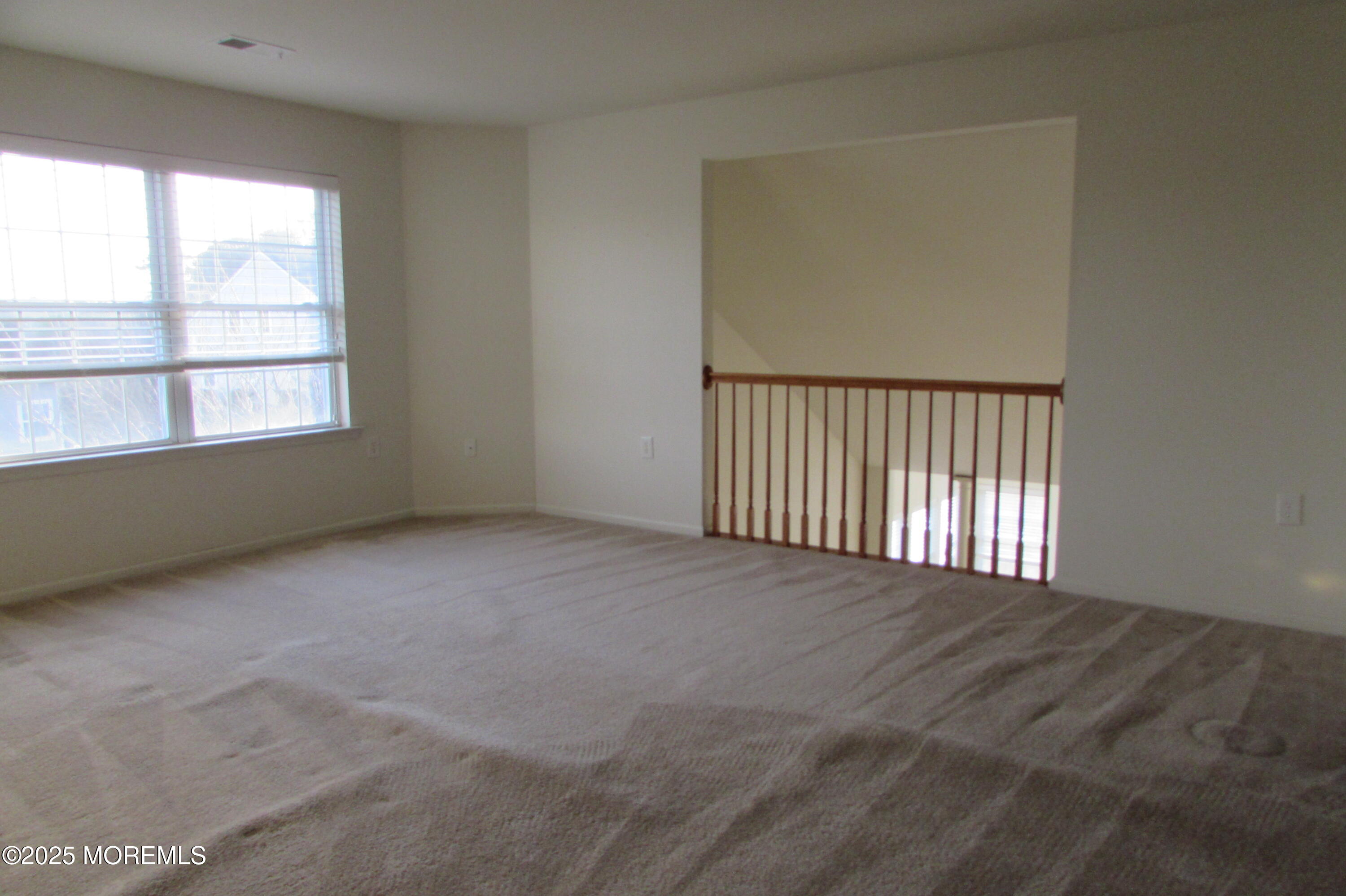 66 Strathmere Street Waretown, NJ 08758 - Photo 27 of 29 an empty room with a window