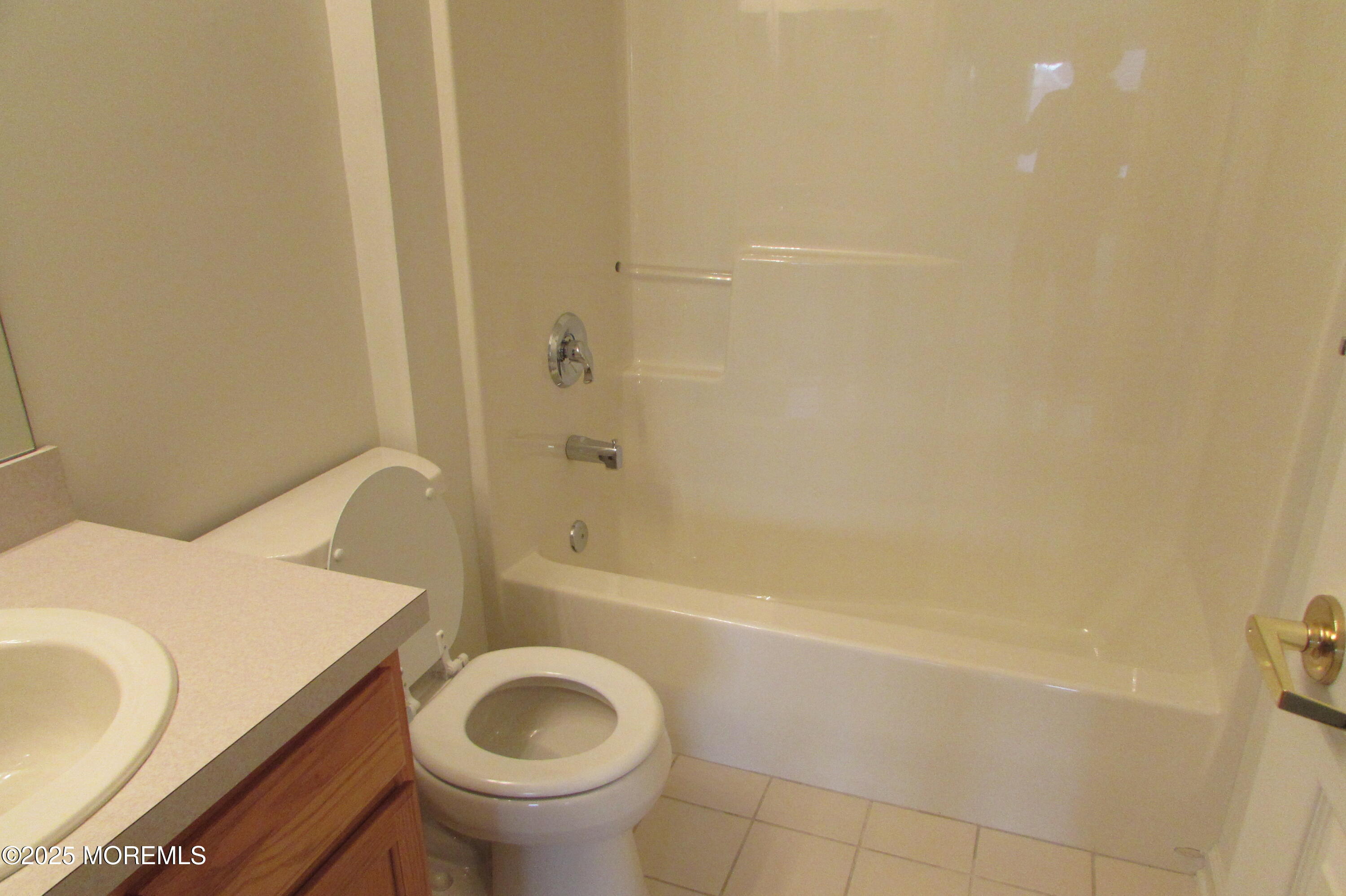 66 Strathmere Street Waretown, NJ 08758 - Photo 28 of 29 a bathroom with a sink a toilet and bathtub