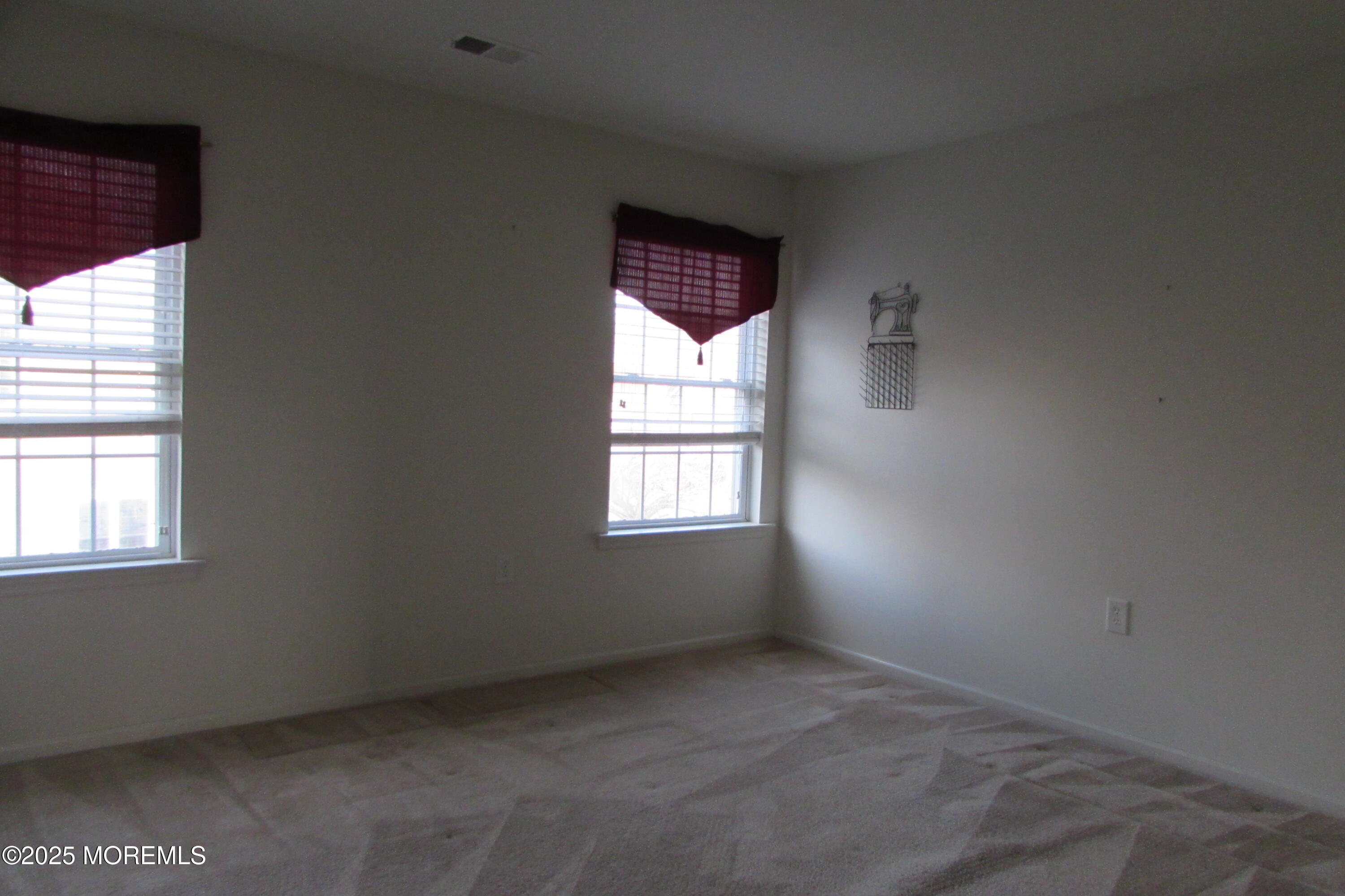 66 Strathmere Street Waretown, NJ 08758 - Photo 29 of 29 an empty room with windows