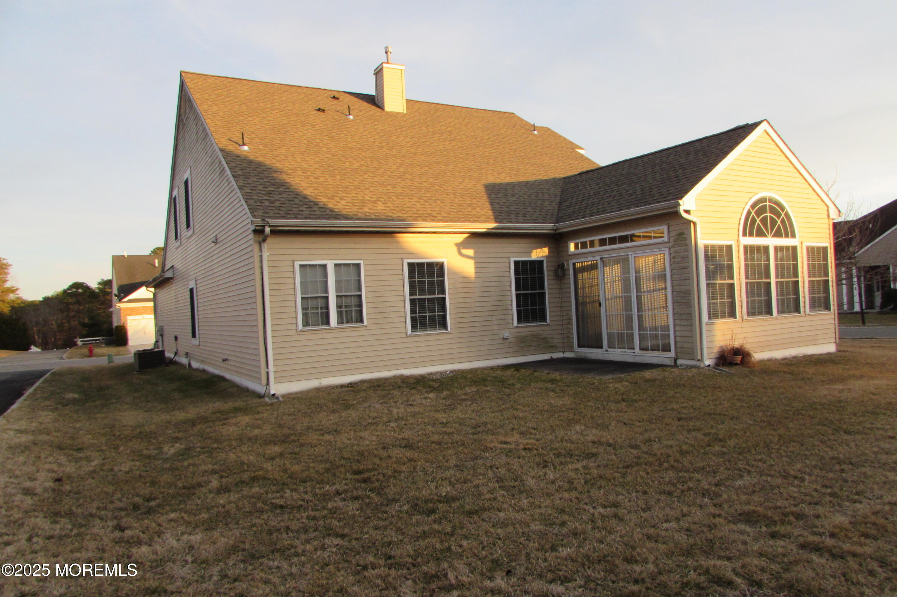 66 Strathmere Street Waretown, NJ 08758 - Photo 5 of 29 a front view of a house with a garden