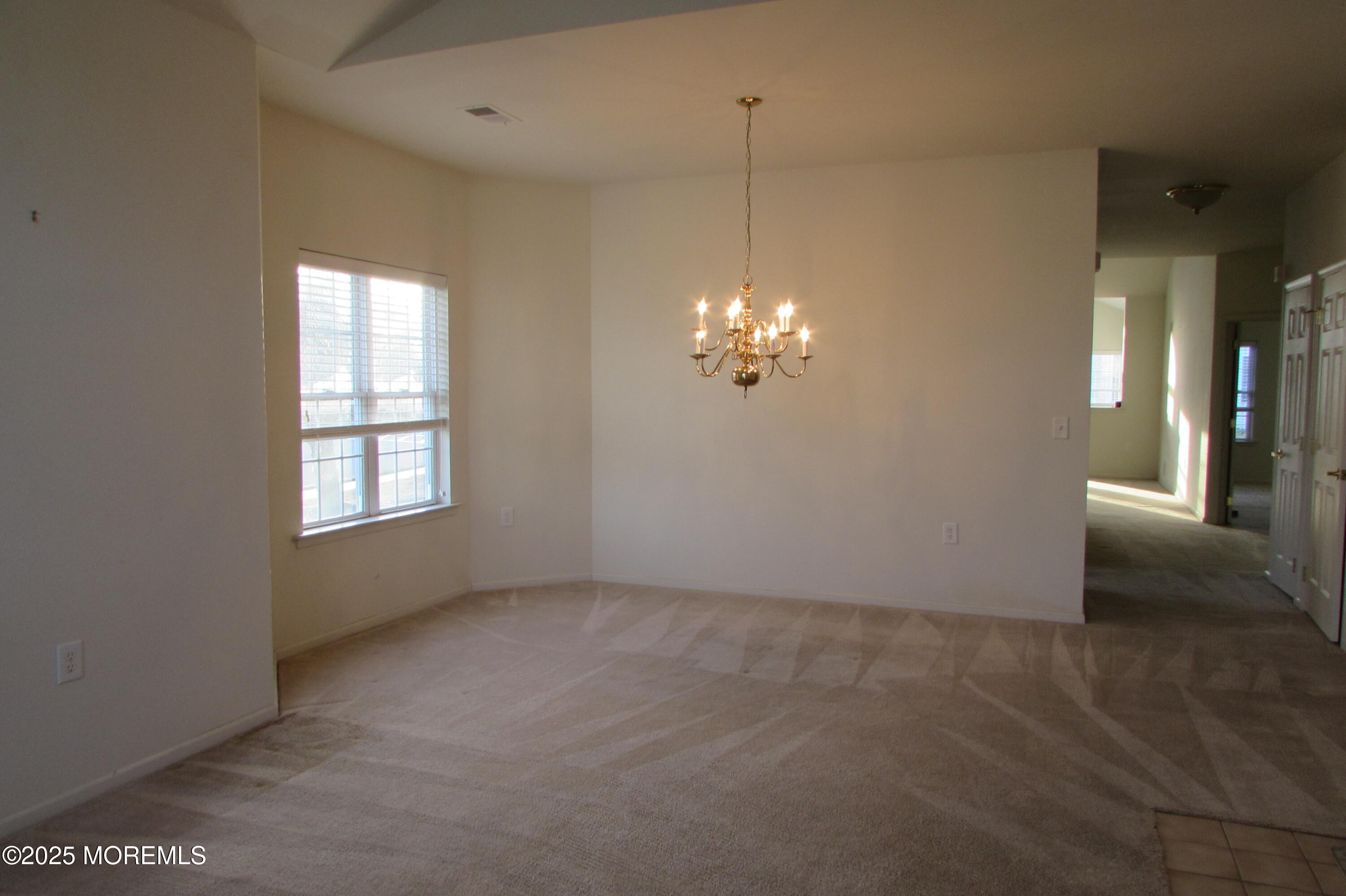 66 Strathmere Street Waretown, NJ 08758 - Photo 8 of 29 a view of an empty room with a window