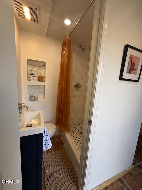 1623 Ocean Avenue Ventura, CA 93001 - Photo 12 of 15 a bathroom with a sink and mirror with toilet