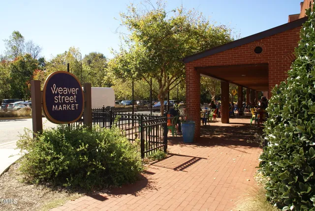 a view of a sign board with a street