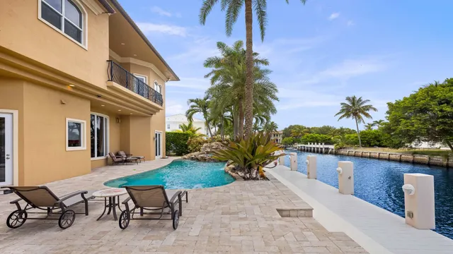 a view of a swimming pool and chairs