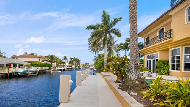 an aerial view of residential houses with outdoor space and river view