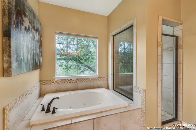 a bathroom with 2 sink and a mirror