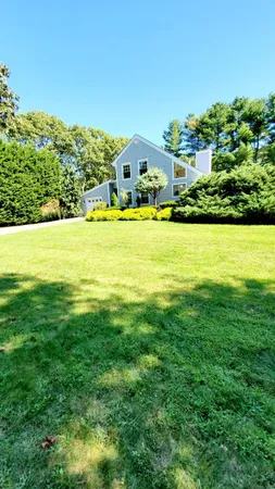 a aerial view of a house with a big yard