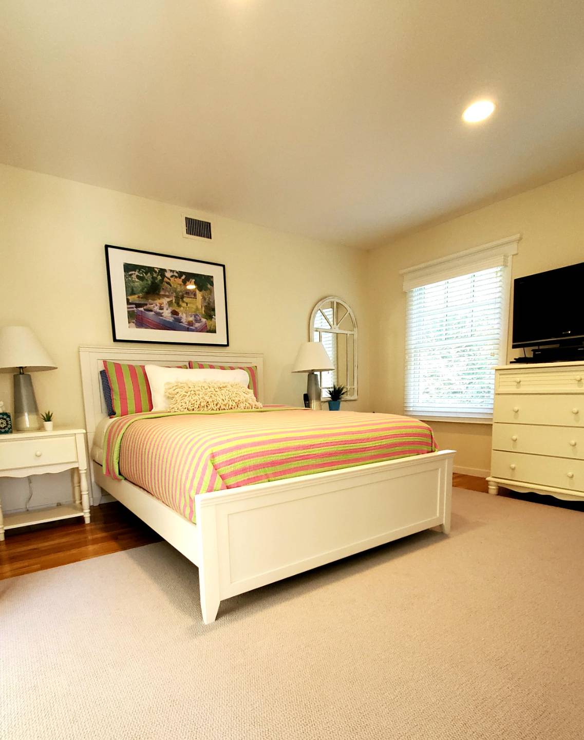 Undisclosed Address Remsenburg, NY 11960 - Photo 11 of 17 a bedroom with a bed and a flat screen tv