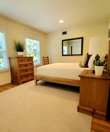 a bedroom with a bed and furniture